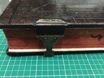  Clasp attached to binding 